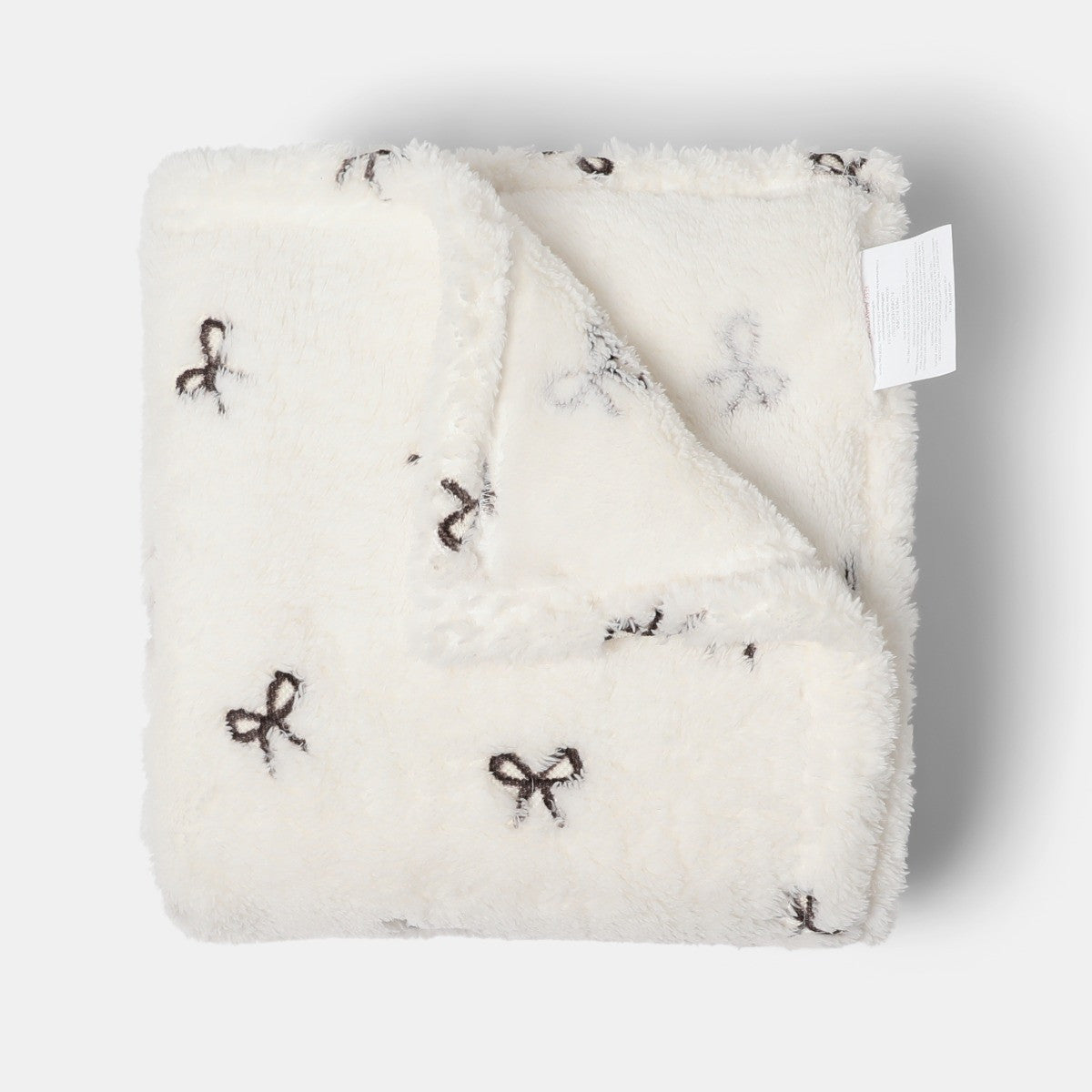 Bow Embossed Fleece Throw – Monochrome