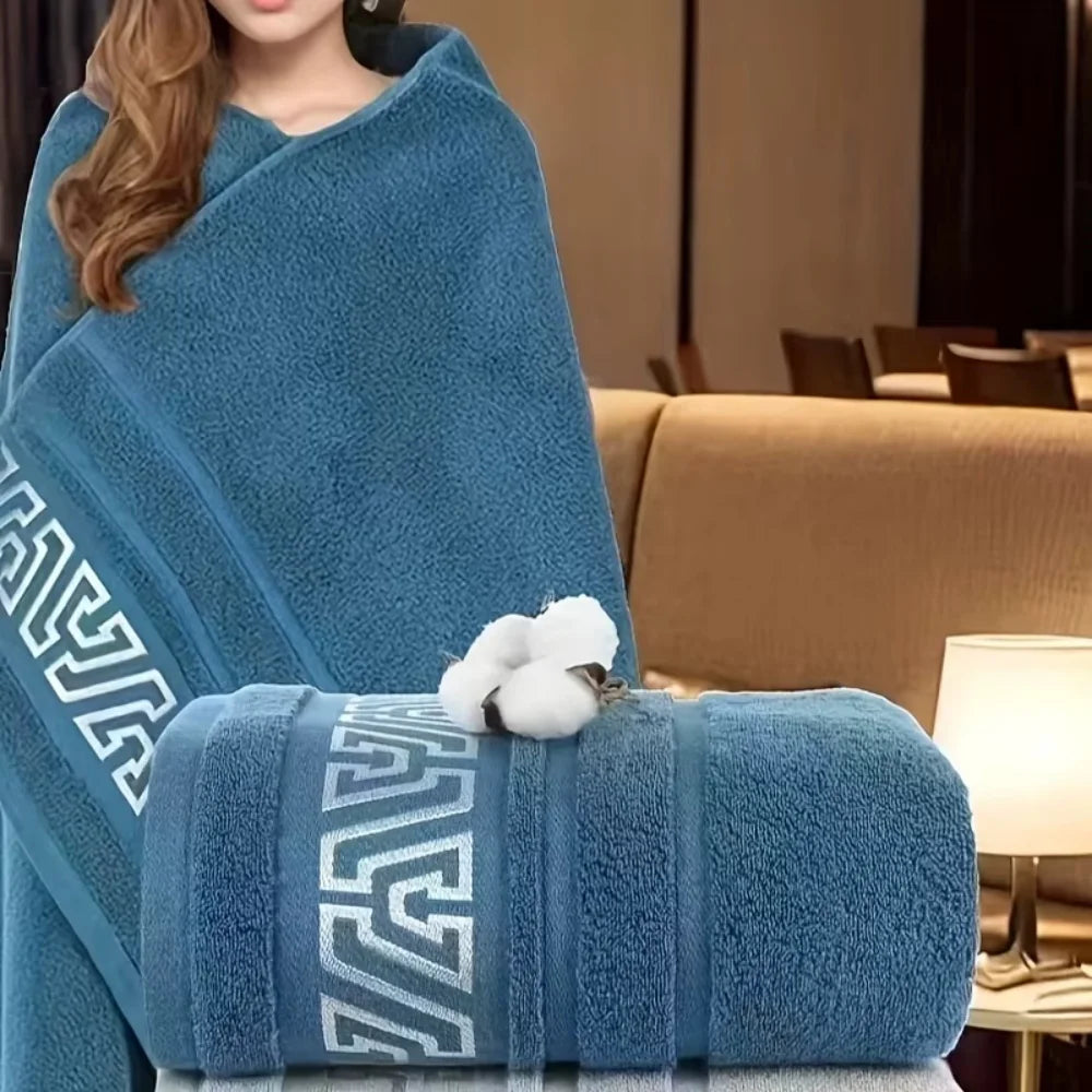 Cotton bath towel wrapped round shoulders